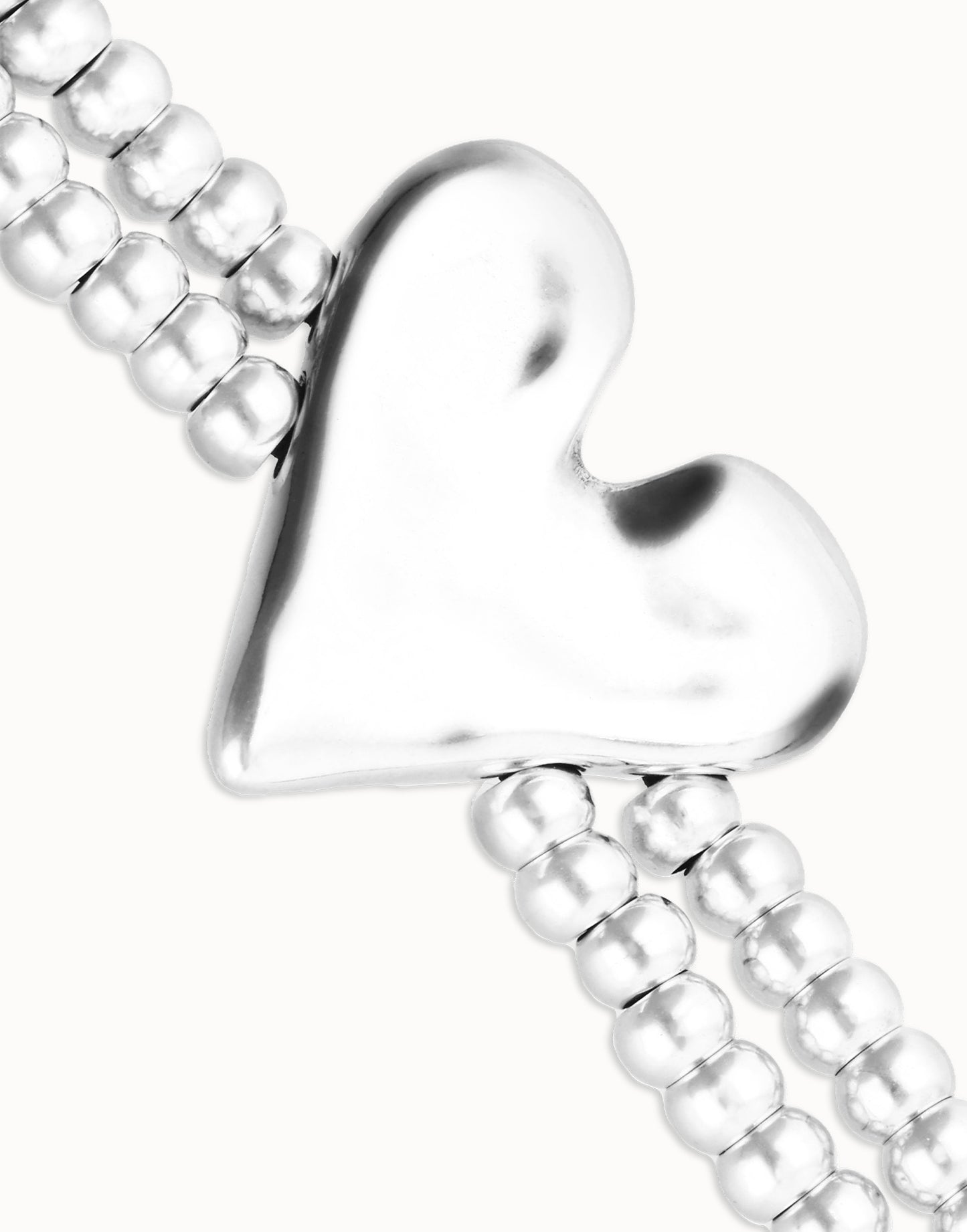 Double elastic bracelet with heart detail