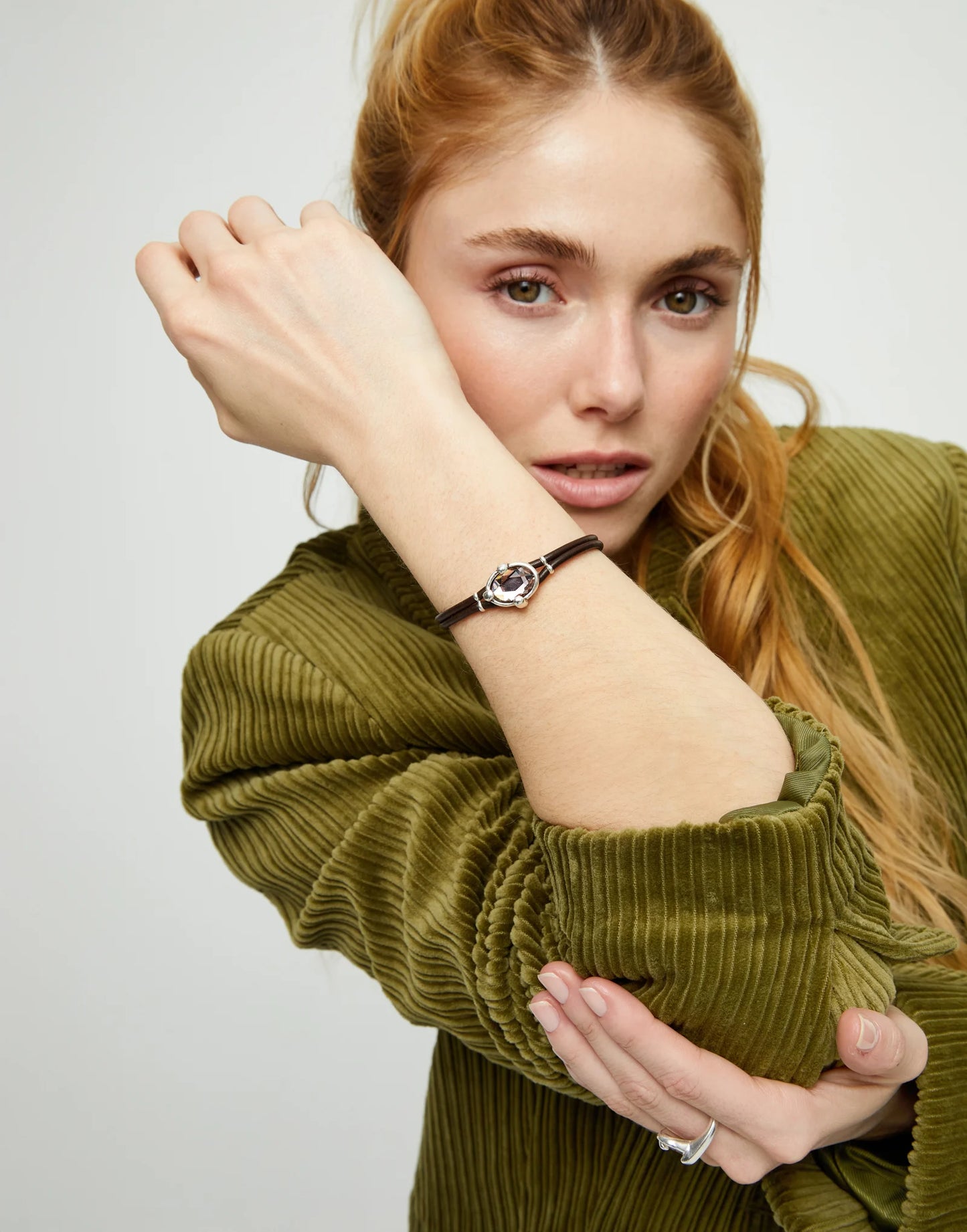 Leather bracelet with pink oval faceted crystal