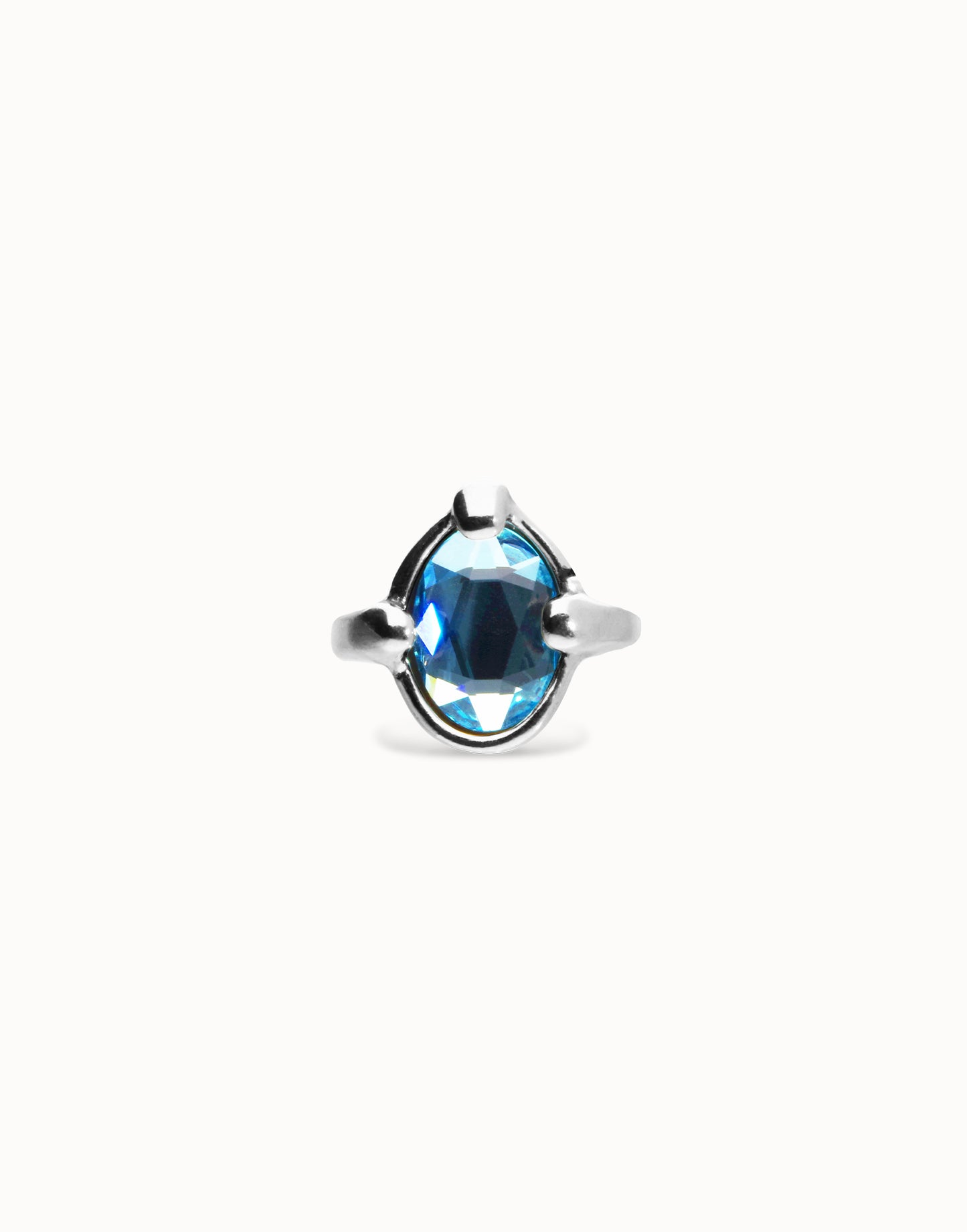 Ring with blue oval faceted crystal