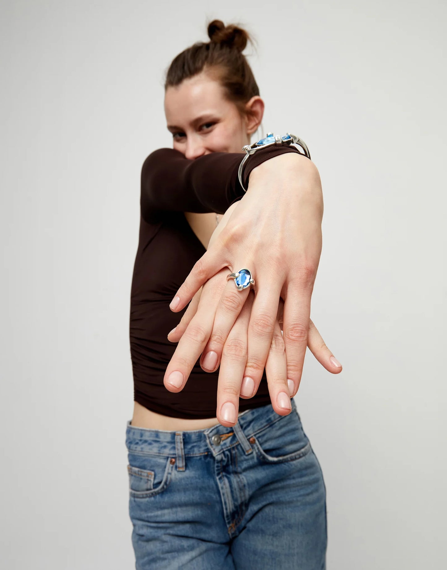 Ring with blue oval faceted crystal