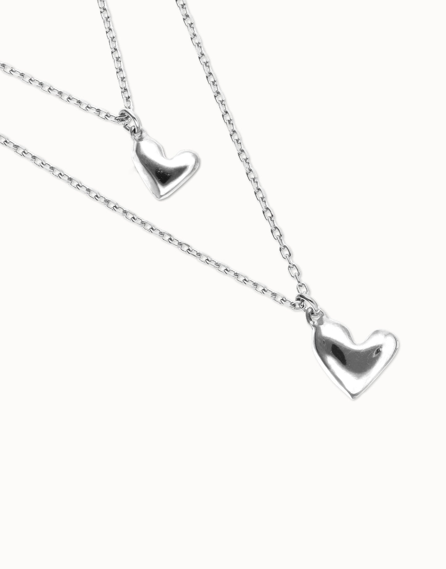 Multi strand chain necklace with two hearts