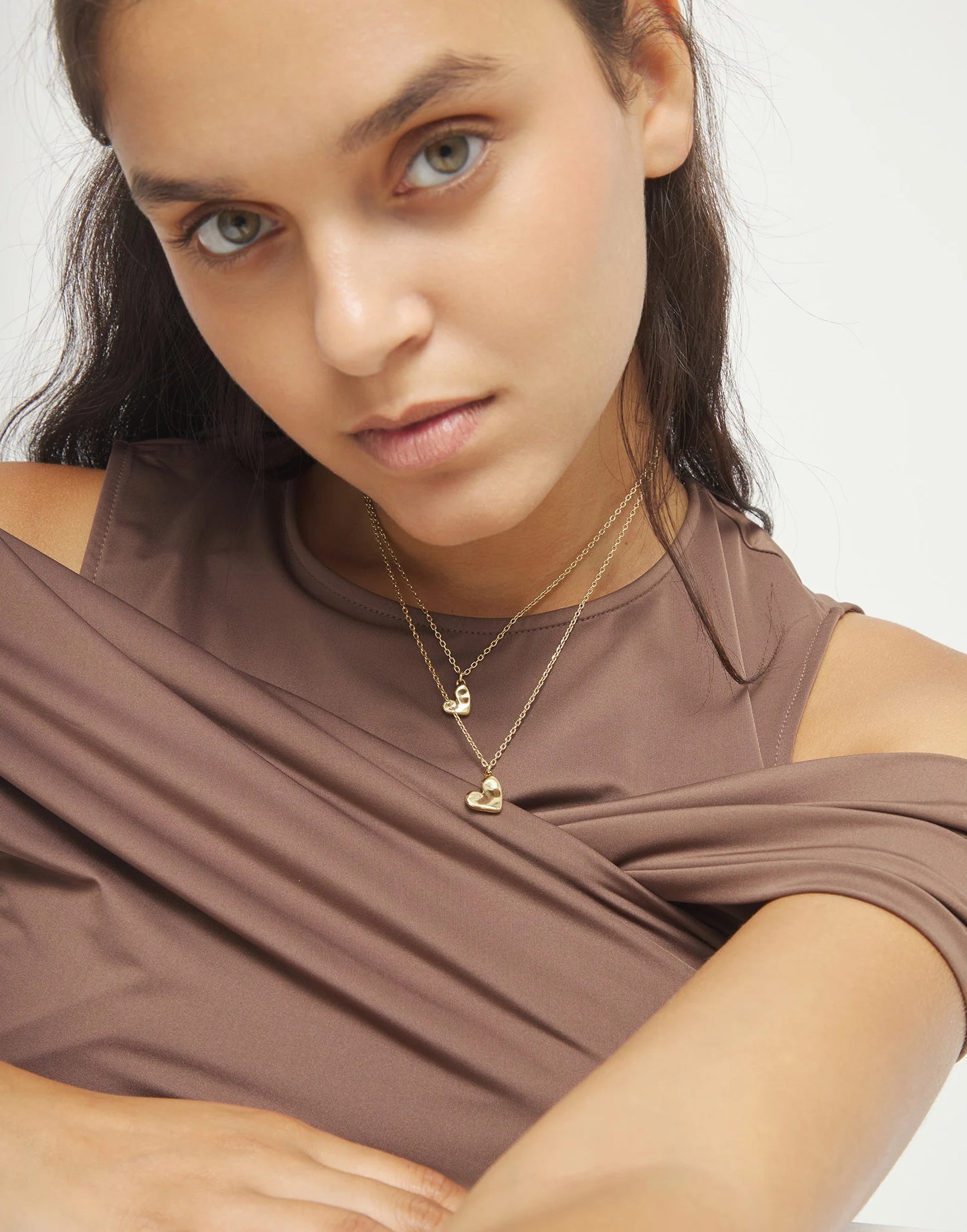 Multi strand chain necklace with two hearts