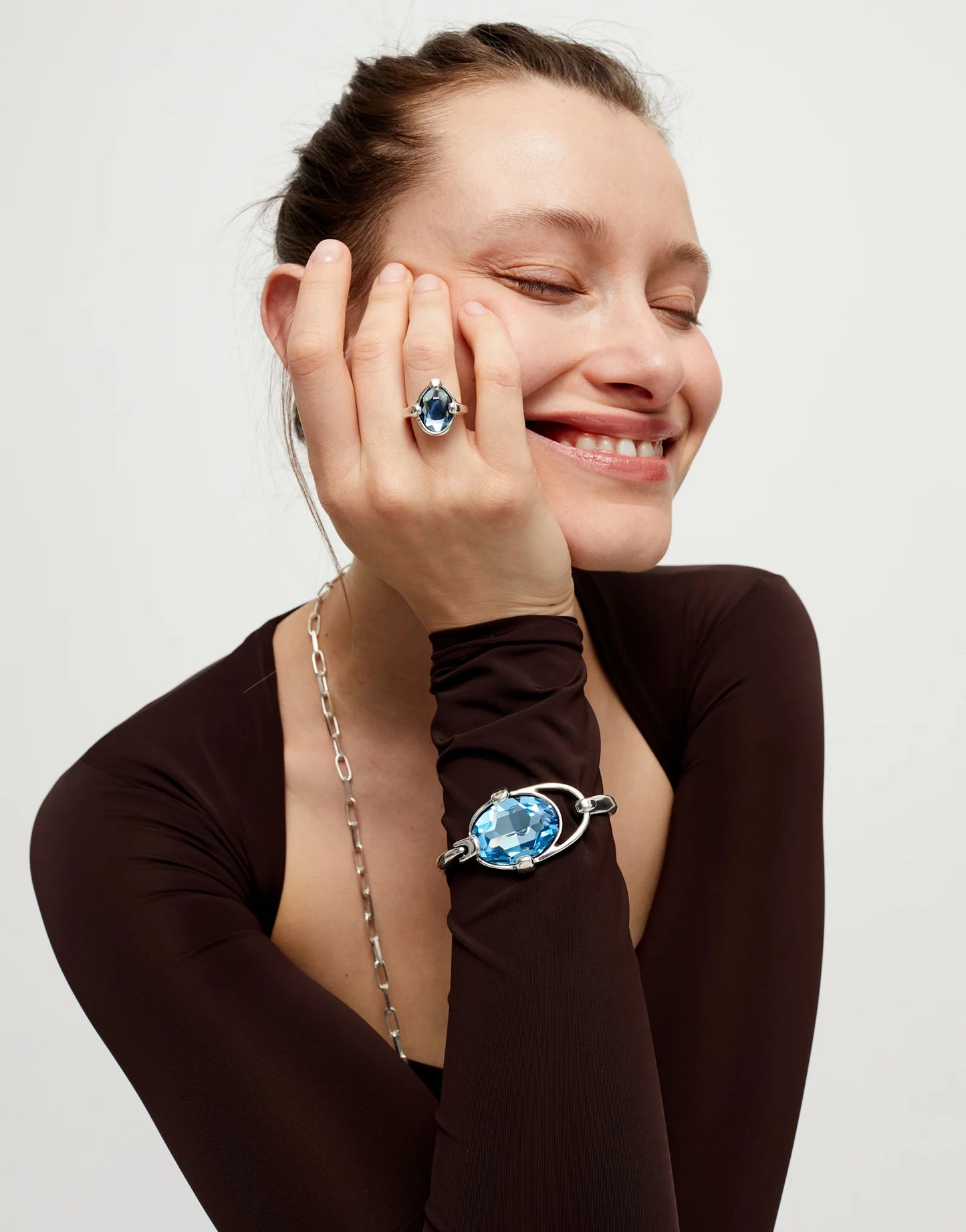 Bangle bracelet with faceted blue crystal