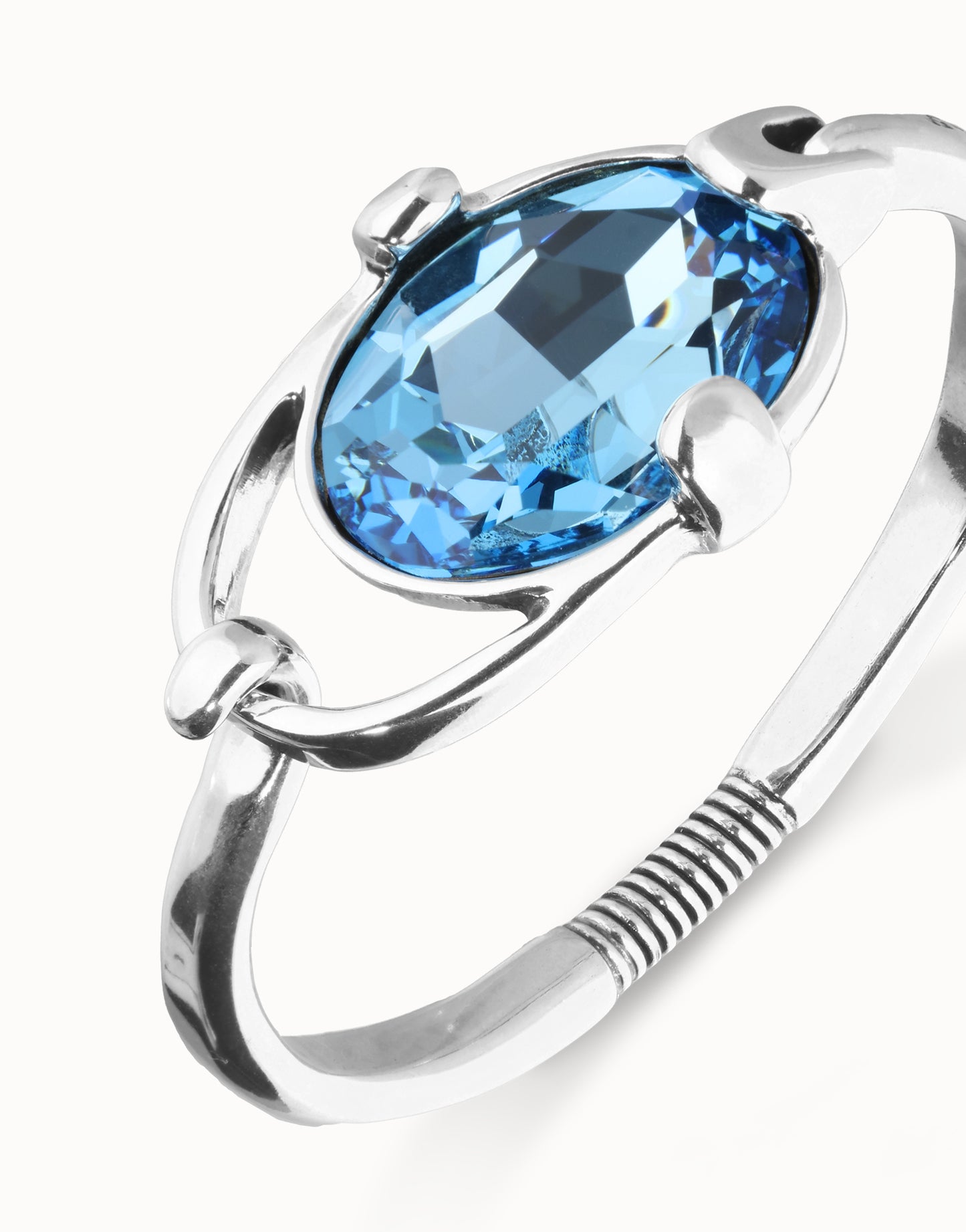 Bangle bracelet with faceted blue crystal