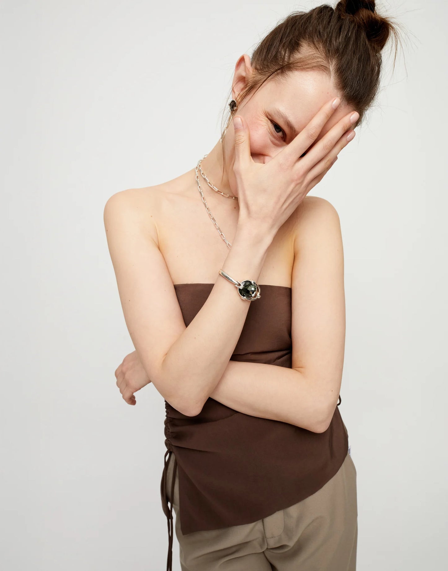 Bangle bracelet with oval faceted gray crystal silver