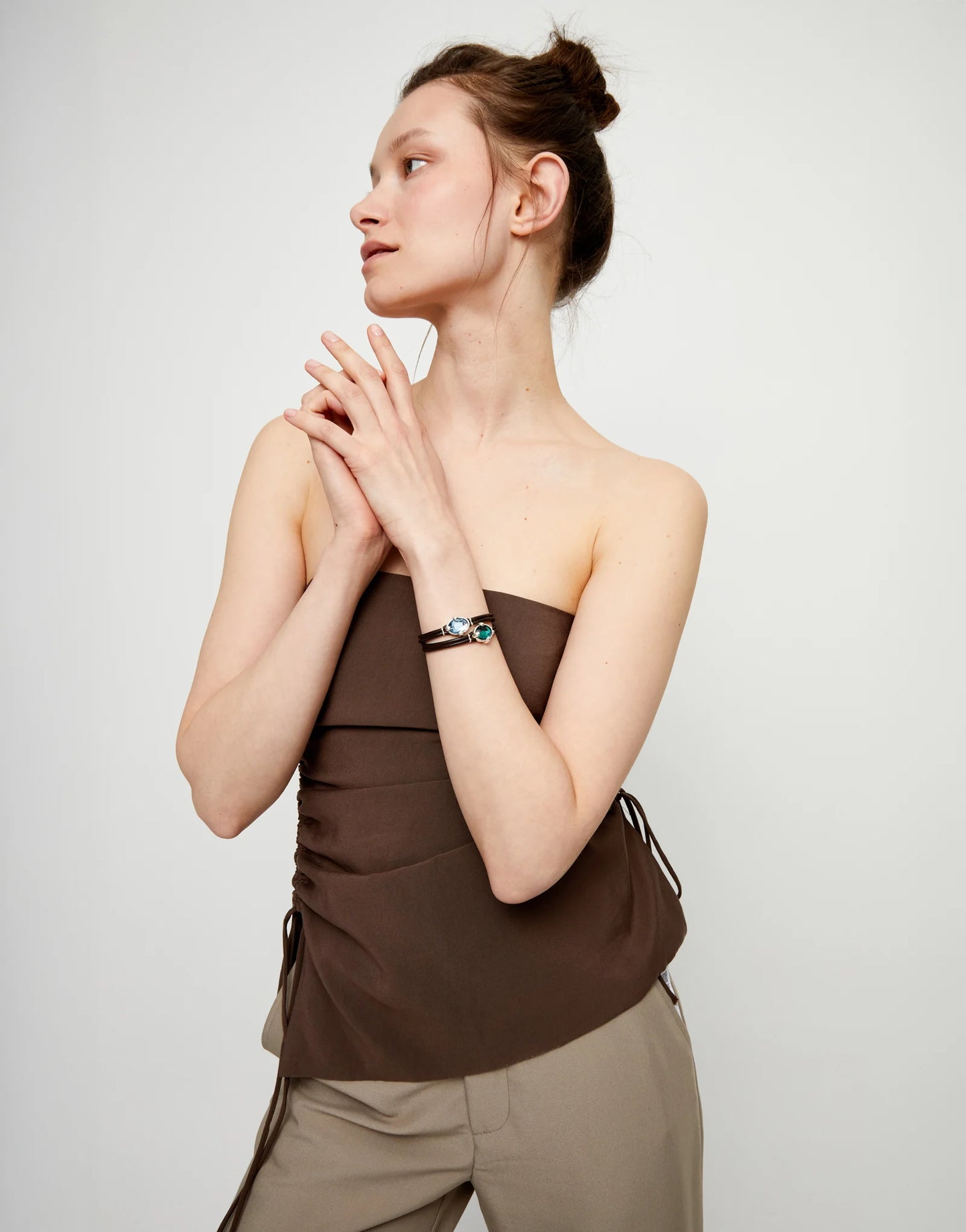 Leather bracelet with blue oval faceted crystal