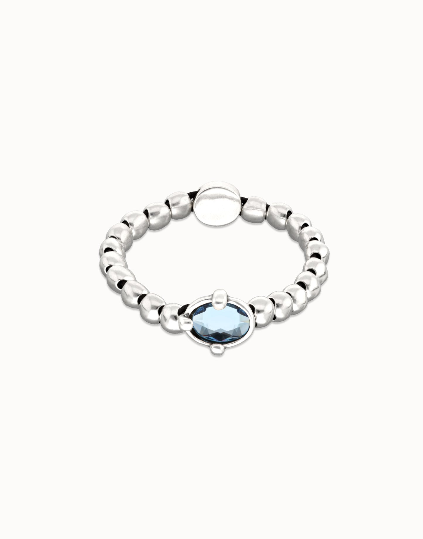 Beaded bracelet with blue oval faceted crystal