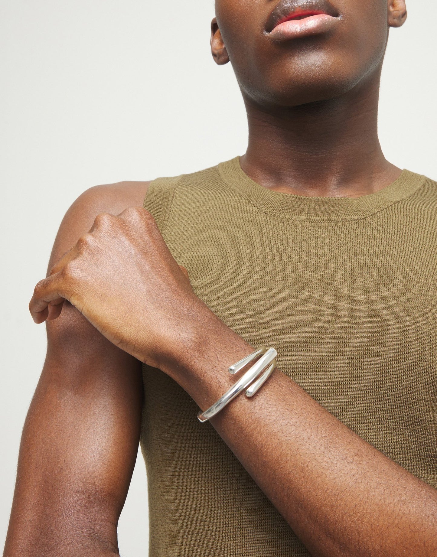 Bangle bracelet with three intertwined organic shapes