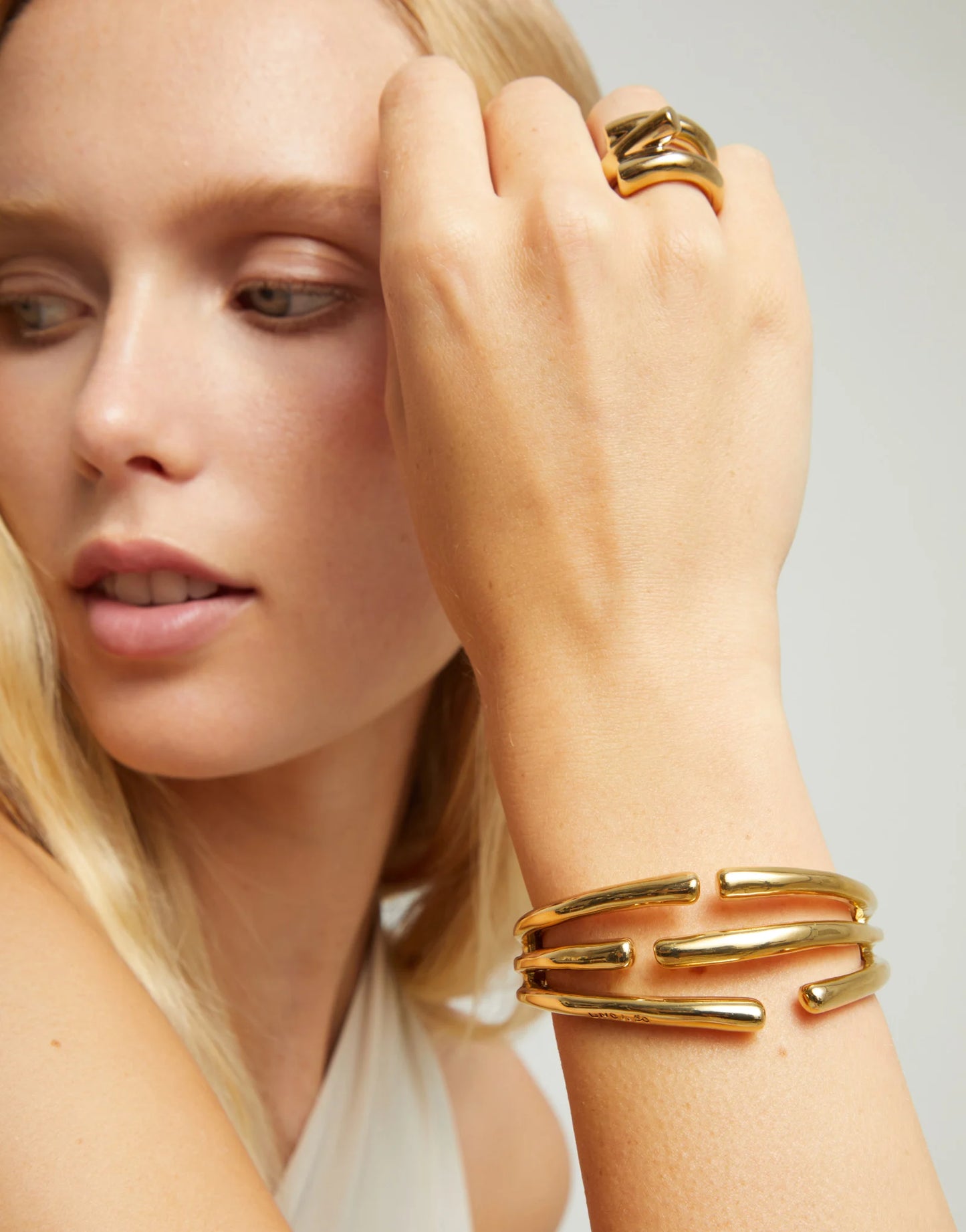 Bangle bracelet with multiple intertwined organic shapes